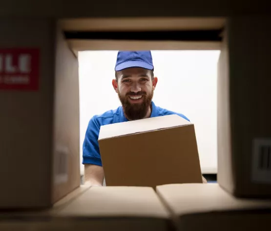 smiling mover sorting boxes